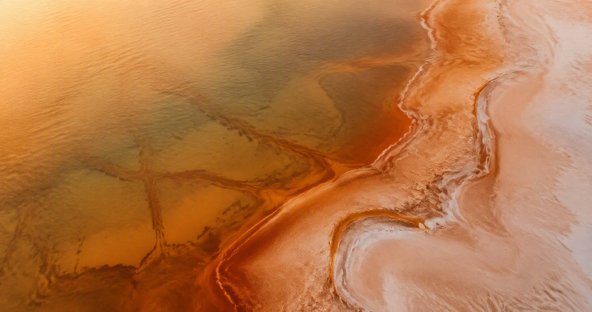 Aerial view of the Lagos lagoon salt flats at golden hour